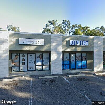 Thumbnail image of the front of a dentist office practice with the name The Denture Center which is located in Tampa, FL