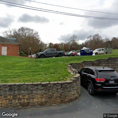 Thumbnail image of the front of a dentist office practice with the name Paul R. Gibbs Periodontics which is located in Davidson, NC