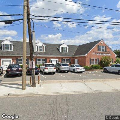 Thumbnail image of the front of a dentist office practice with the name Premier Dental Care which is located in Lynbrook, NY