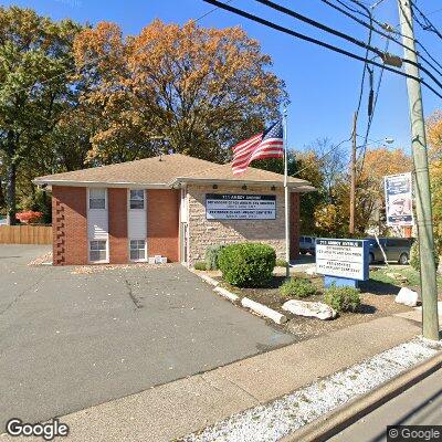 Thumbnail image of the front of a dentist office practice with the name Woodbridge Periodontics which is located in Woodbridge, NJ