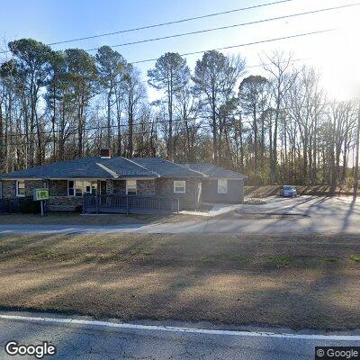 Thumbnail image of the front of a dentist office practice with the name Conyers Denture & Implant Center which is located in Conyers, GA