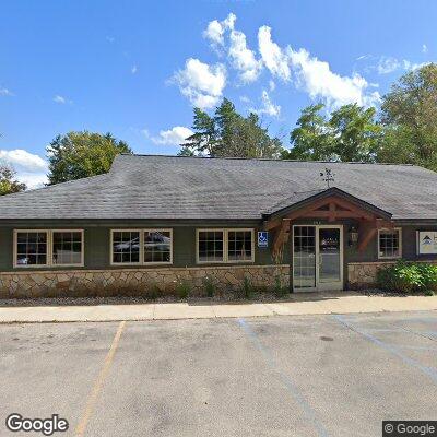 Thumbnail image of the front of a dentist office practice with the name Hall Periodontics which is located in Traverse City, MI