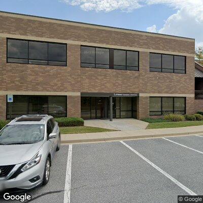 Thumbnail image of the front of a dentist office practice with the name Dolfield Dental which is located in Owings Mills, MD