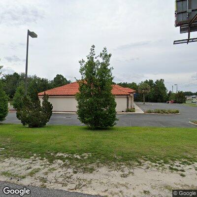 Thumbnail image of the front of a dentist office practice with the name Village Dental which is located in Summerfield, FL