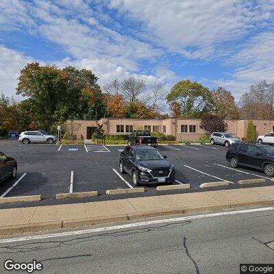 Thumbnail image of the front of a dentist office practice with the name Oral Maxillofacial & Implant which is located in Greenville, RI