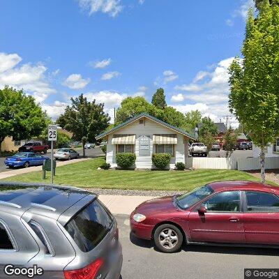 Thumbnail image of the front of a dentist office practice with the name Premier Denture Clinic which is located in Redmond, OR