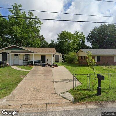 Thumbnail image of the front of a dentist office practice with the name Woodsprings Dentistry which is located in Gulfport, MS