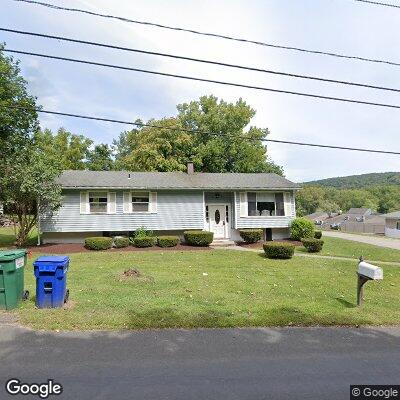 Thumbnail image of the front of a dentist office practice with the name Caring Dental Group which is located in New Milford, CT