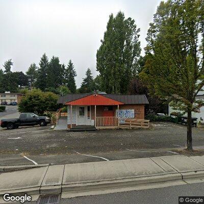 Thumbnail image of the front of a dentist office practice with the name Caring Hands Dental which is located in Burien, WA