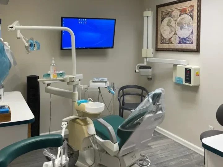 Aesthetics Dental Operatory Room showing modern dental equipment and a TV used for showcasing patient information.